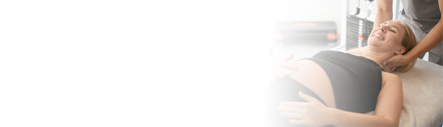 A DC adjusts a pregnant patient's neck.