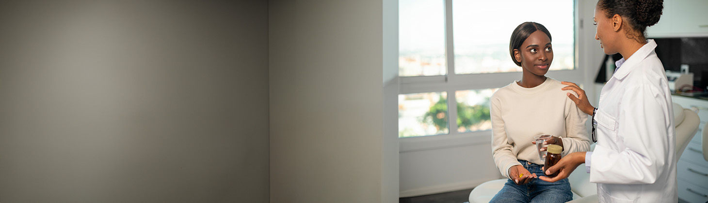 A naturopathic physician talks to a patient about a weight-loss product.