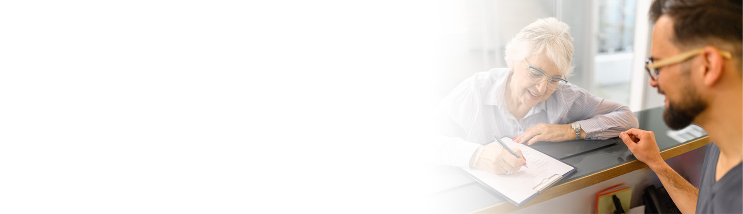 A patient signs an informed consent form