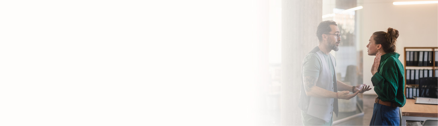 A chiropractor and patient appear to be arguing or having an intense conversation.