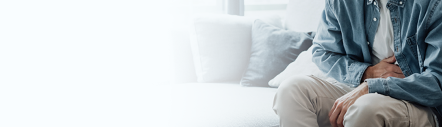 Person holding hand on stomach