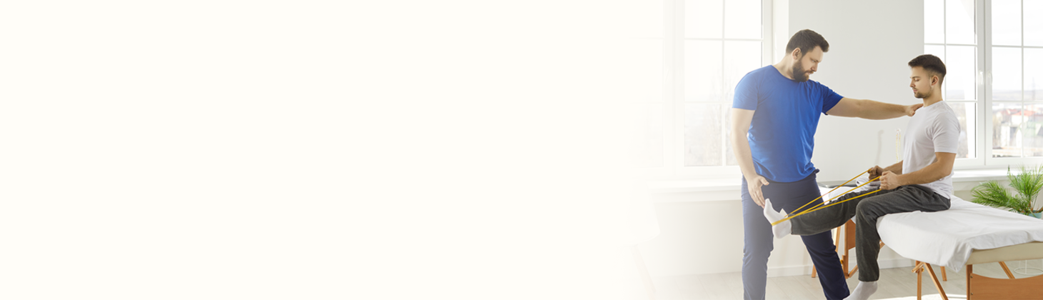 A sports chiropractor helps an athlete patient.