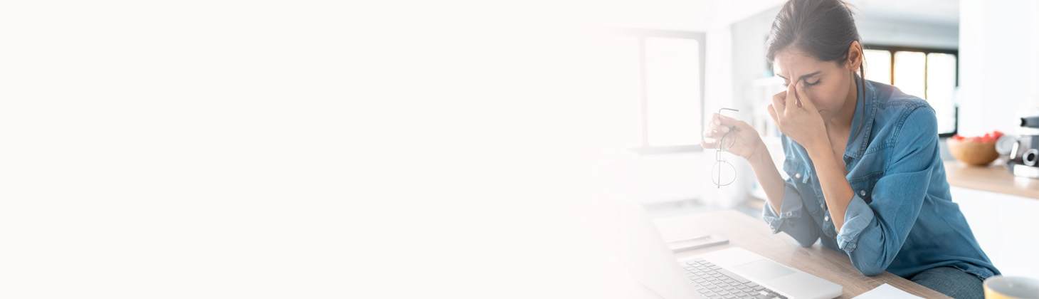 A naturopathic physician sitting at a desk.