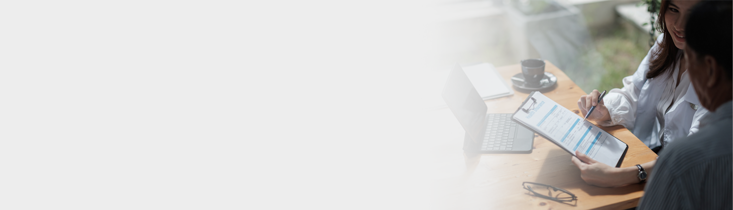 A woman looks at a checklist on a clipboard